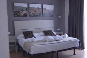 Desk, blackout curtains, free cots/infant beds, free WiFi