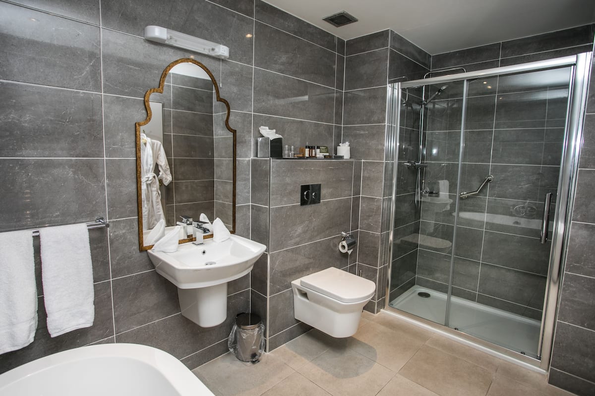 junior suite, 1 king bed | bathroom | rainfall showerhead, free toiletries, hair dryer, towels