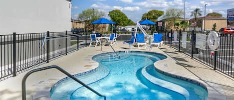 Outdoor pool, open 6:00 AM to 10:00 PM, pool umbrellas