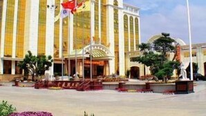 A large building with multiple golden domes and a central entrance. - King We Holiday Hotel (Quanzhou)