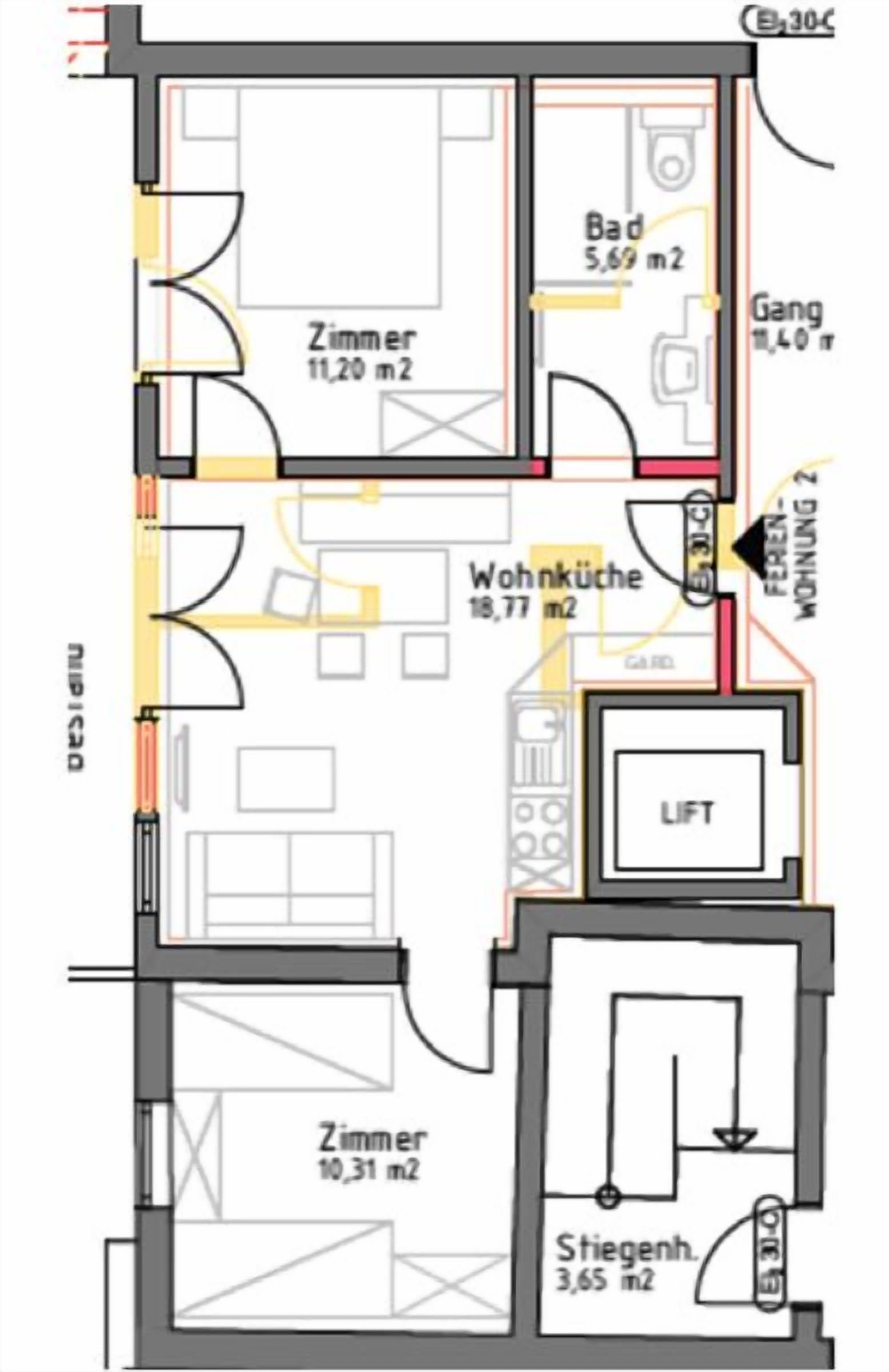A hotel floor plan with multiple rooms, including a living room, a bathroom, and a kitchen area.