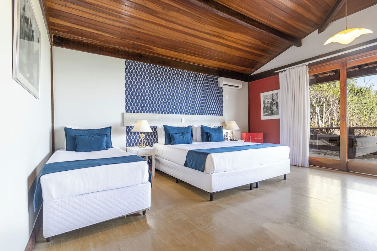 Triple Room, Balcony | Minibar, in-room safe, individually decorated, blackout drapes