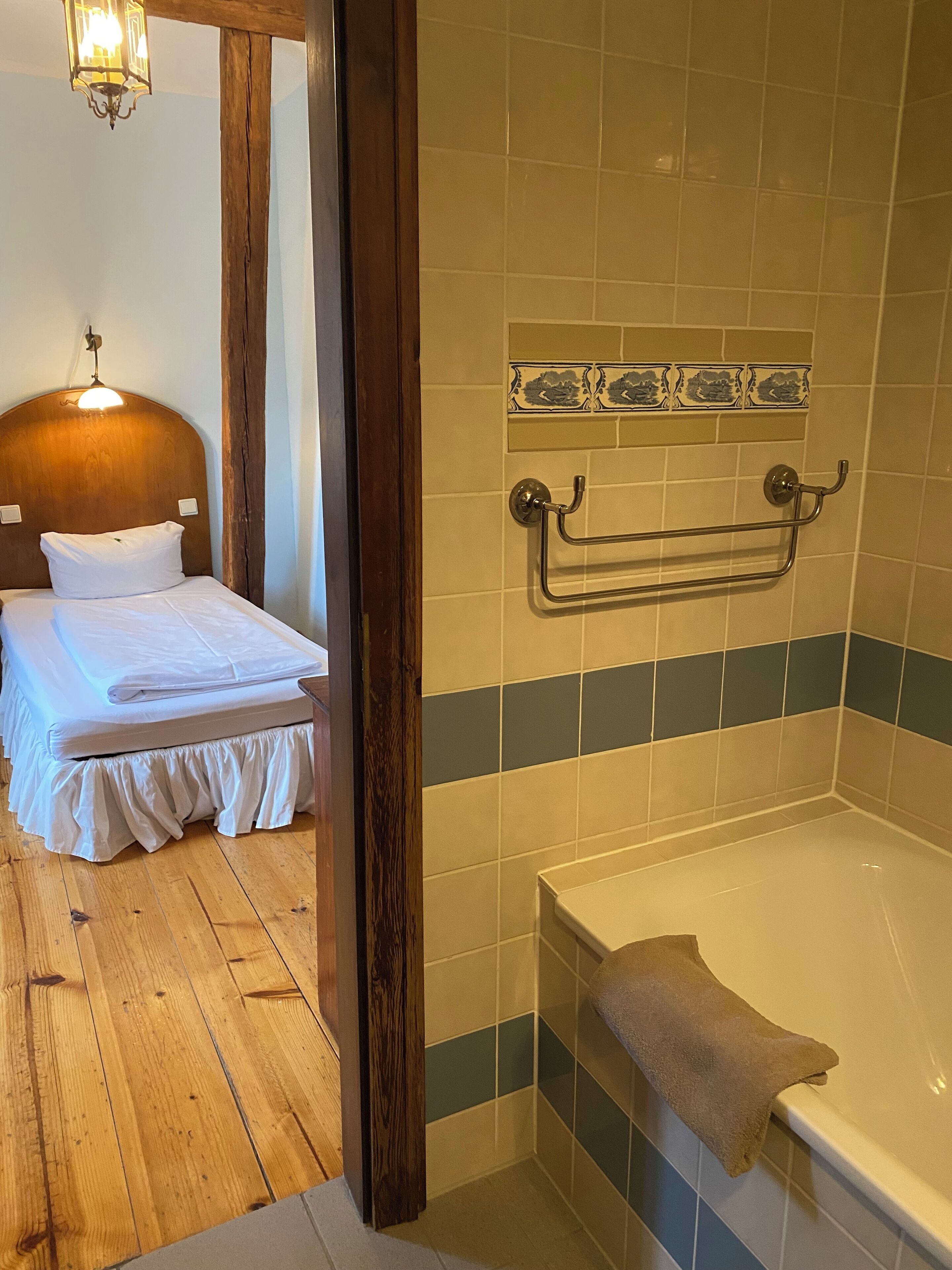 single room | bathroom | bathtub, hair dryer, towels