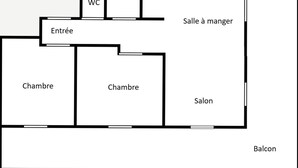 Ein Grundriss mit zwei Schlafzimmern, einem Badezimmer, einer Küche, einem Essbereich, einem Wohnzimmer und einem Balkon.