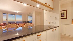 Family Room | Private kitchen | Fridge, microwave, oven, stovetop - Dolphin Beach H108 (Cape Town)
