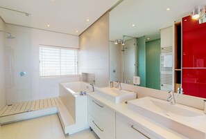 A modern bathroom with two sinks, a large mirror, and a shower. - Horizon Bay 1602 (Cape Town)