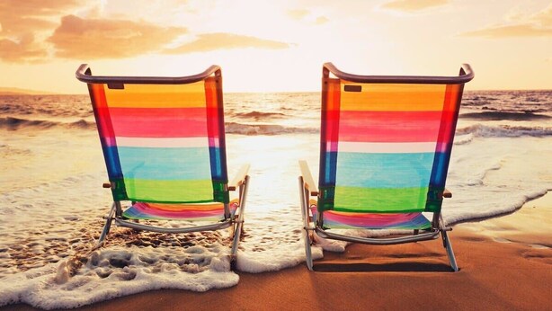 Two beach chairs facing the ocean with a sunset in the background. - Hazels Child Oceanfront Large  Beach House (North Myrtle Beach)