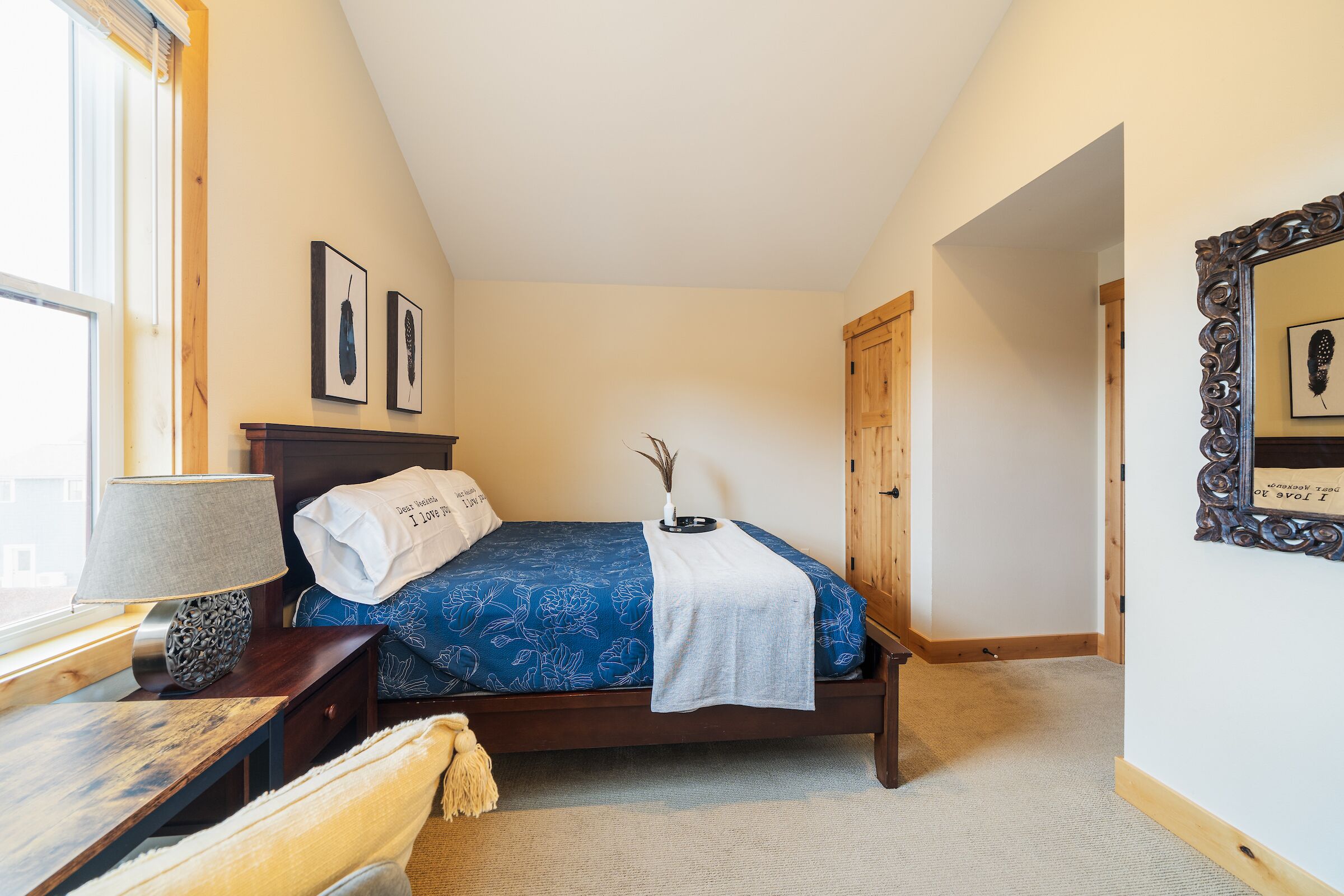Upper level queen bedroom with vaulted ceilings