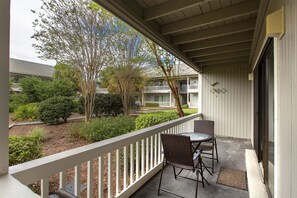 Enjoy a serene view of the landscaped garden from this balcony.