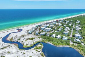 An aerial view of a coastal residential area with houses, a beach, and a river. - Lone Star - Updated Gulf-View Home in Gulf Trace of Grayton Beach, Private Pool! (Gulf Trace)
