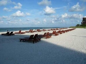 On the beach, sun-loungers, beach towels