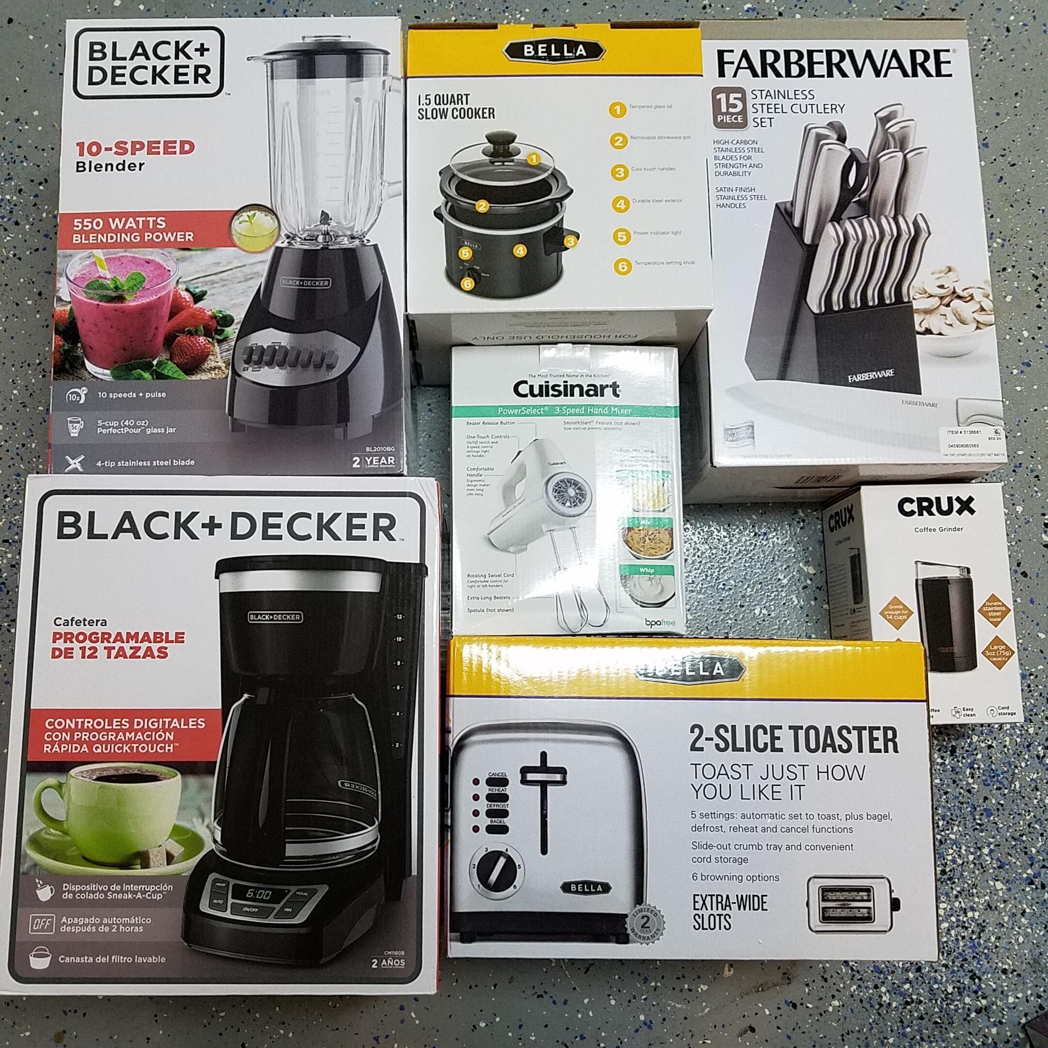 Various kitchen appliances including a blender, slow cooker, coffee grinder, and toaster, each with their respective packaging.