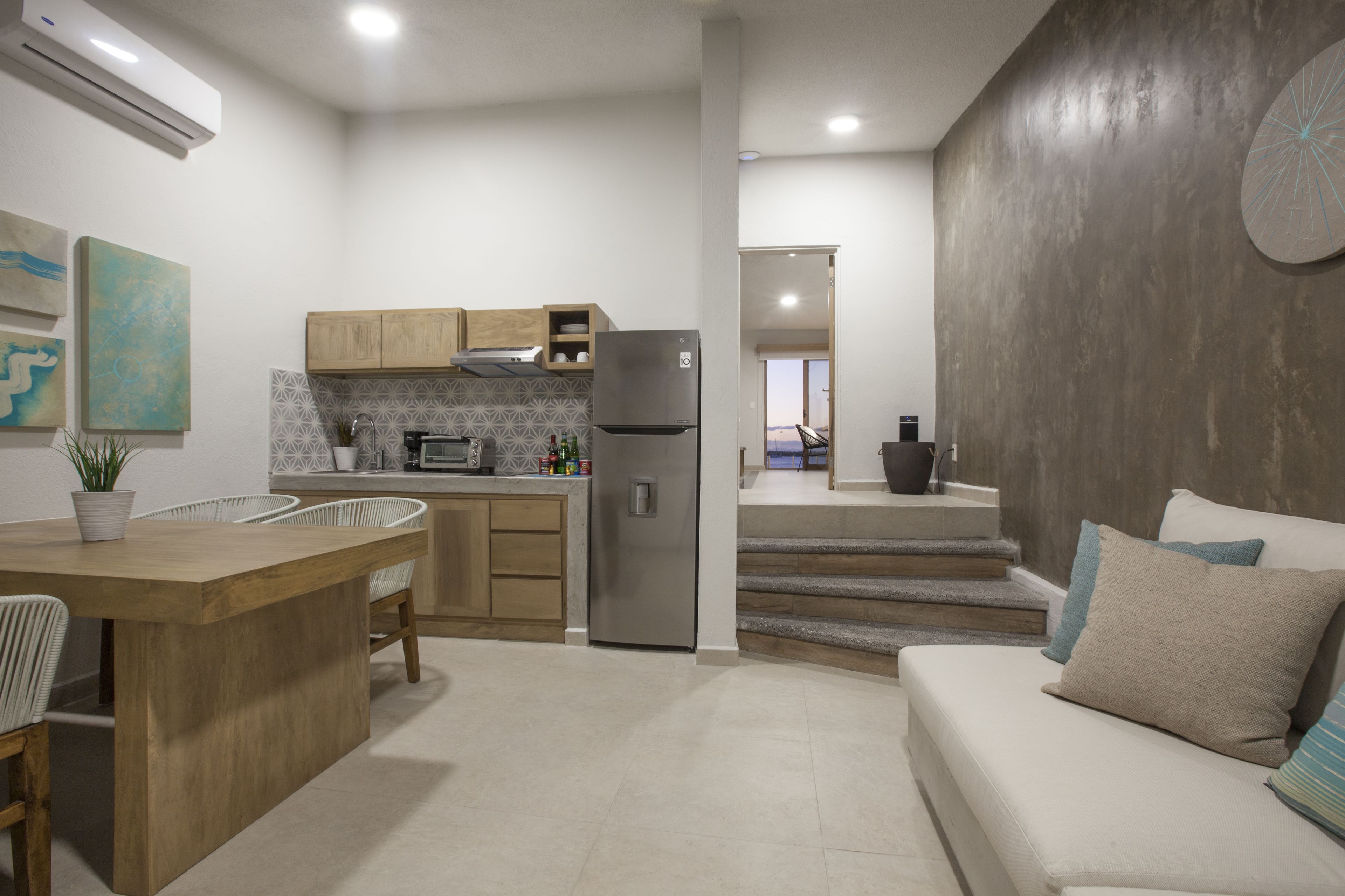 design suite, 1 bedroom, kitchen, beachfront | living area | flat-screen tv, netflix