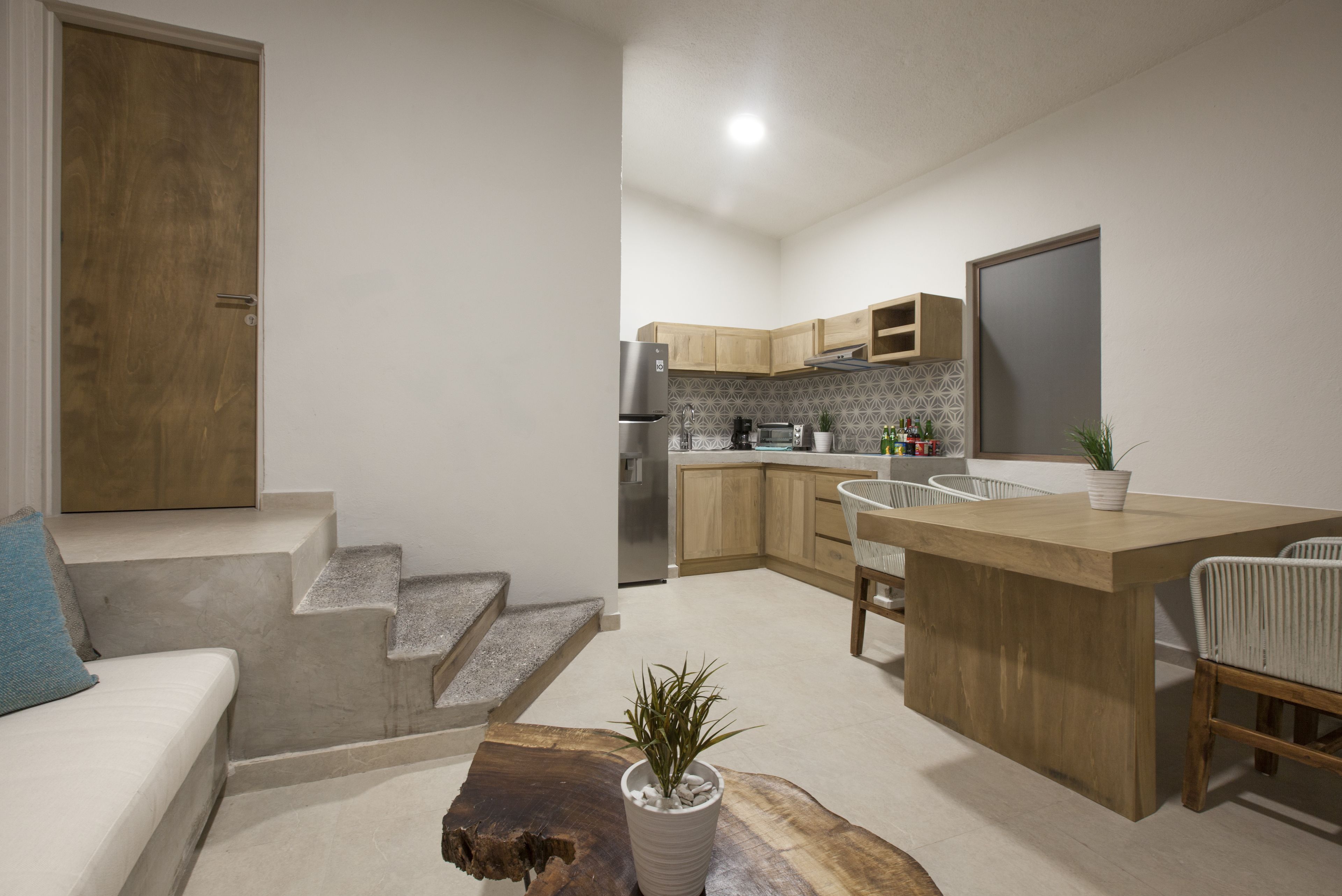 full-sized fridge, stovetop, toaster oven, cookware/dishes/utensils