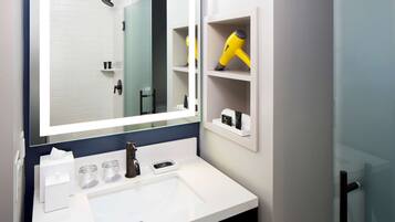 Shower, designer toiletries, hair dryer, bathrobes