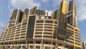 A multi-story building with a curved facade, large windows, and a central atrium. - Silk Sky Residence (Seri Kembangan)
