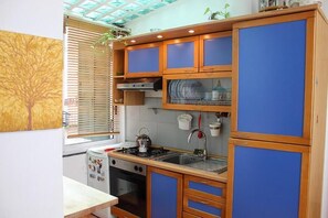 Fridge, stovetop, espresso maker, cookware/dishes/utensils