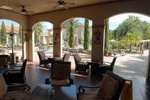 Outdoor dining - Gorgeous Condo in Prestigious Championsgate Golf Resort Community w View of Pool (Championsgate)
