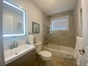 Combined shower/bathtub, hair dryer, towels, soap