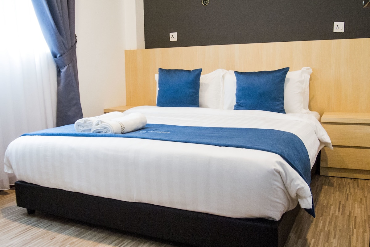 Premium bedding, blackout curtains, iron/ironing board, free WiFi