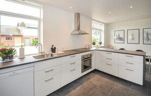 Fridge, stovetop, dishwasher, coffee/tea maker