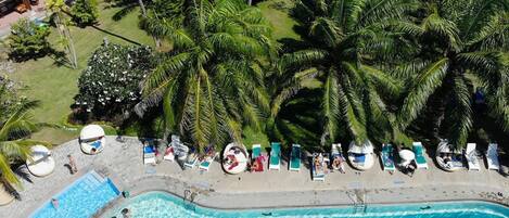 Outdoor pool, open 7:00 AM to 7:00 PM, free cabanas, pool umbrellas