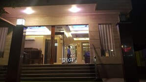 A multi-story hotel with a prominent 'MIRA' sign on the facade. - Mira International (New Delhi)