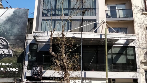 A tall building with multiple balconies and large windows. - Cute Abasto Apartment (Buenos Aires)