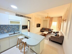Suite, 1 Bedroom | Living room | 42-inch LCD TV with satellite channels, TV - A'Sinamar Hotel Apartment (Muscat)