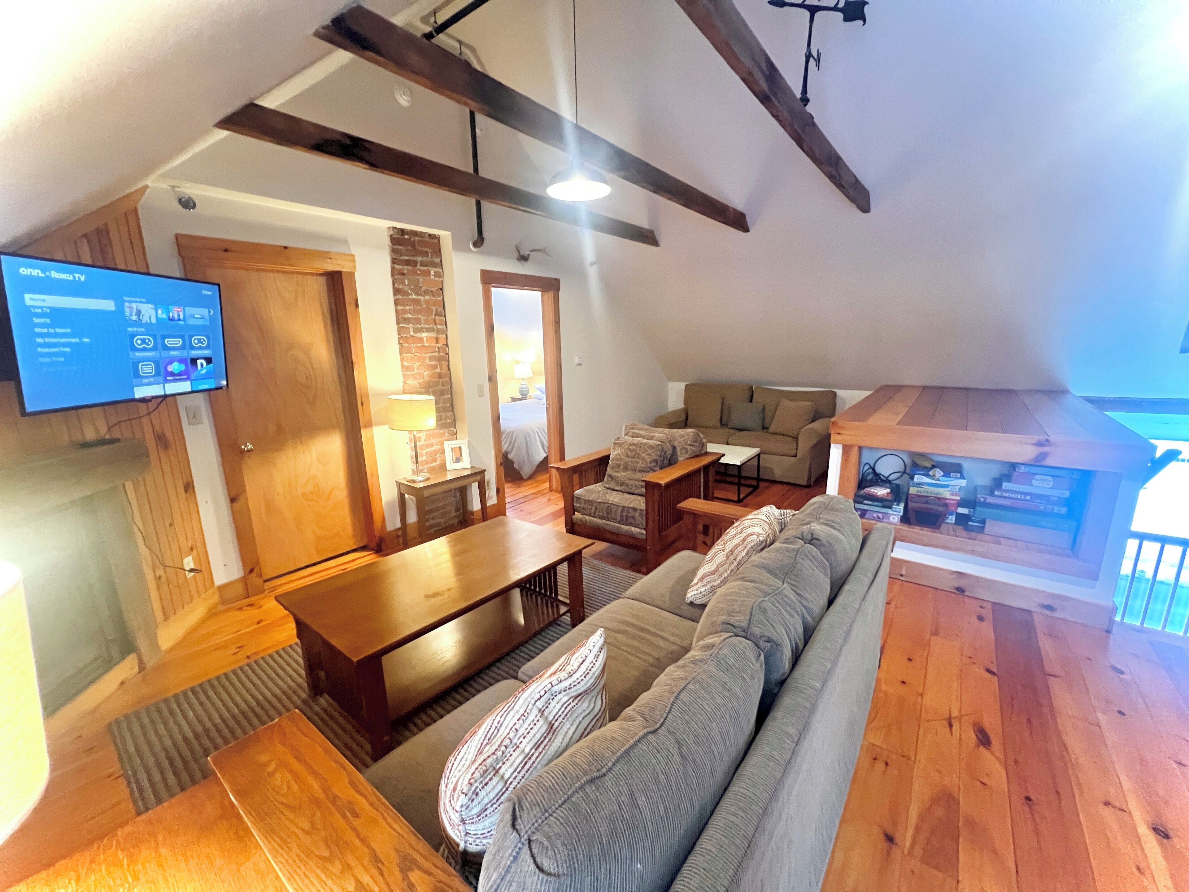 Smart TV, fireplace, books, computer monitors