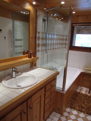 Combined shower/tub, hair dryer, towels, soap