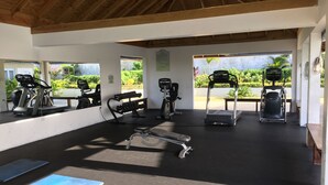 A gym with treadmills, weight machines, and dumbbells. - Your Secret Paradise , Richmond-St.Ann (St.Anns)