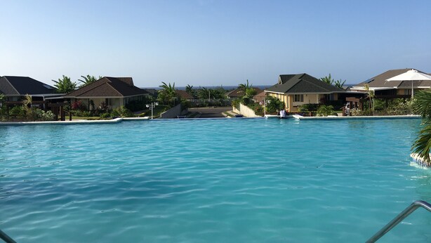 A swimming pool with a clear view of the ocean in the background. - Your Secret Paradise , Richmond-St.Ann (St.Anns)