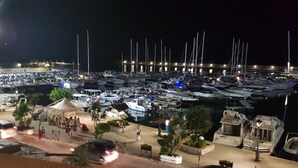 A marina at night with numerous boats docked. - Cozy Green Kitchen Apartment (marina di camerota)