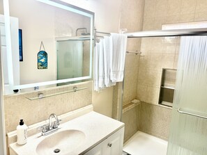 Shower, hair dryer, towels, soap