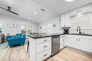 Enjoy cooking in this well-equipped kitchen with dishwasher and stainless steel sink.