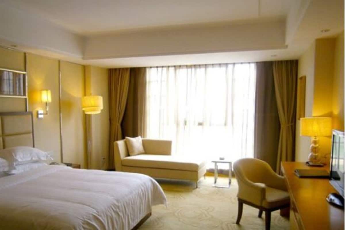 Habitación Deluxe con 1 cama doble o 2 individuales | Escritorio, cortinas opacas, tabla de planchar con plancha y wifi gratis