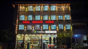A hotel with a modern facade, labeled with 'HOTEL', 'ROOMS', 'RESTAURANT', and 'BANQUET'. - Treebo JD Residency Mohali (Mohali)