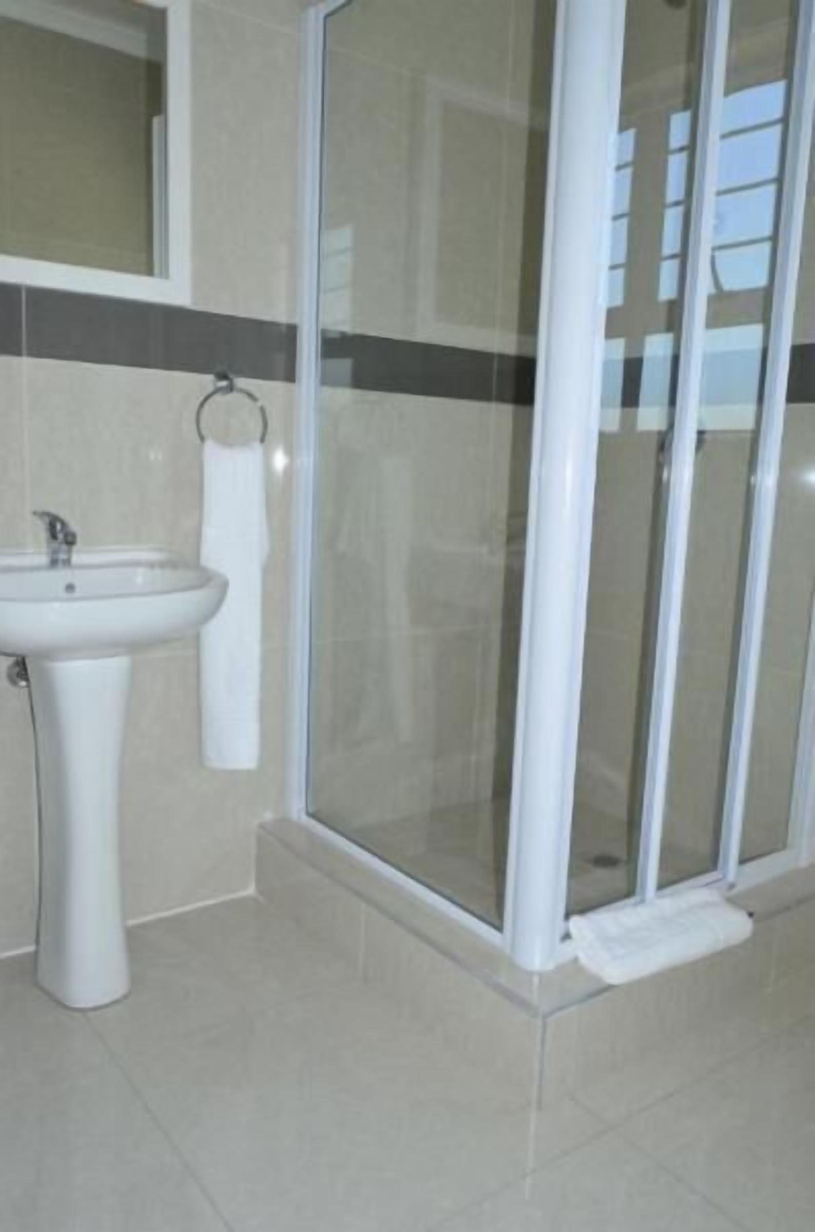 Deep-soaking bathtub, rainfall showerhead, free toiletries, towels