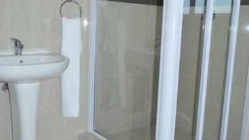 Deep-soaking bathtub, rainfall showerhead, free toiletries, towels