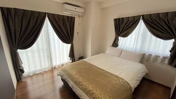 Desk, laptop workspace, blackout drapes, soundproofing