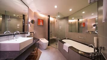 Deep-soaking bathtub, rainfall showerhead, free toiletries, hair dryer