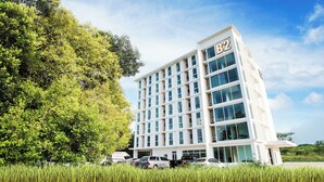 A multi-story hotel with a modern design, featuring a prominent 'B2' sign on the top.
