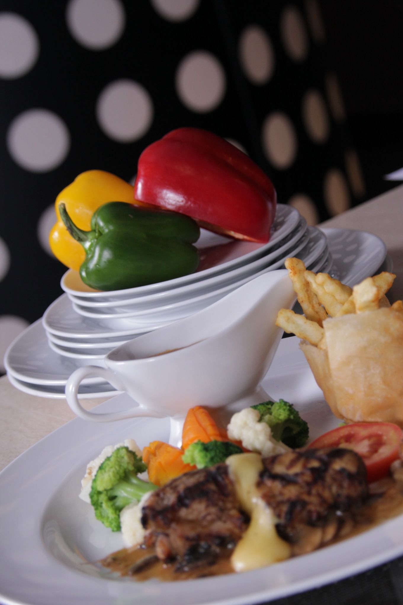 A plate of food with vegetables and a piece of meat.