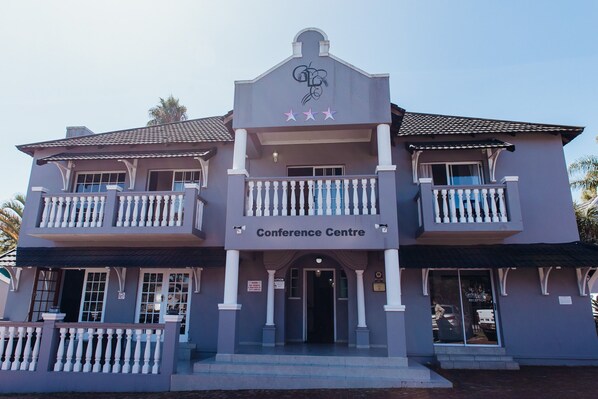 A two-story building with a balcony on each floor, labeled as a Conference Centre. - George Lodge International (George)