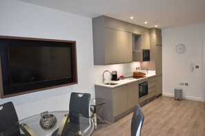 Apartment, 1 Double Bed, Non Smoking | Living room | Flat-screen TV, DVD player