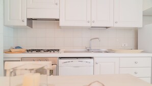 Apartment, 1 Bedroom | Private kitchen | Full-size fridge, stovetop, cookware/dishes/utensils - Portisco - WR Apartments (Olbia)