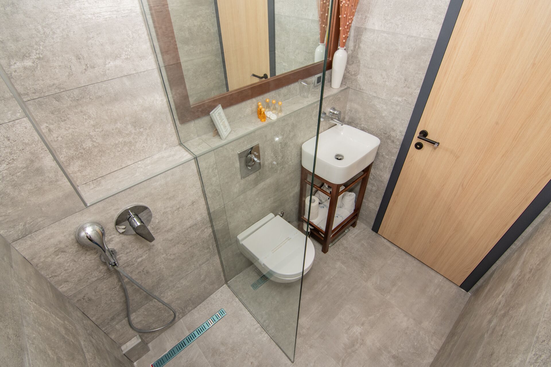 shower, designer toiletries, hair dryer, slippers