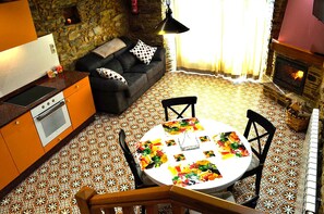 Cozy living space with a kitchen, dining area, and comfortable seating.