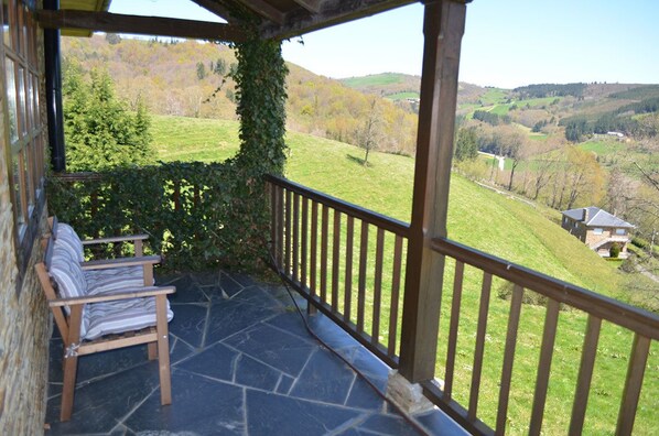 Relax in a serene outdoor space with a view of the surrounding landscape.